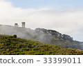 Countryside tower in light fog at morning. 33399011
