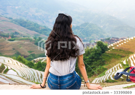 Girl sitting at rice terrace viewpoint Girl sitting at rice terrace viewpoint 33399869