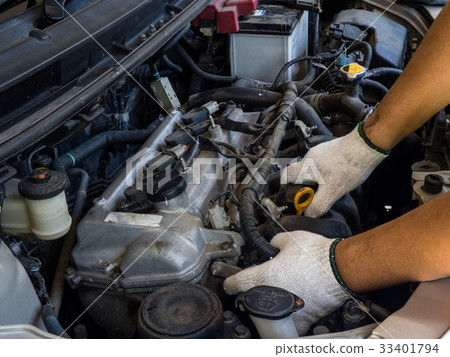 Car mechanic working in auto repair service 33401794