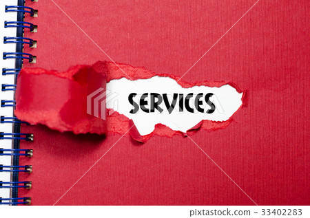 The word services appearing behind torn paper 33402283