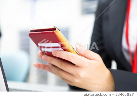 Female employee using a smartphone OL Businessman Salaryman PC Office image Business image Female employee using a smartphone OL Businessman Salaryman PC Office image Business image 33403857