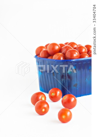 blue plastic box full of tomatoes isolated blue plastic box full of tomatoes isolated 33404784