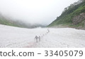 Snowy mountain climbing 33405079