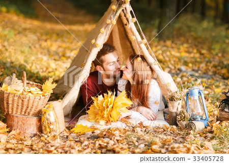 Man and woman hikers camping in autumn nature 33405728