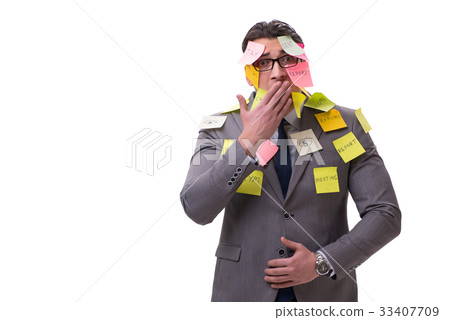 Businessman with many reminders isolated on white Businessman with many reminders isolated on white 33407709