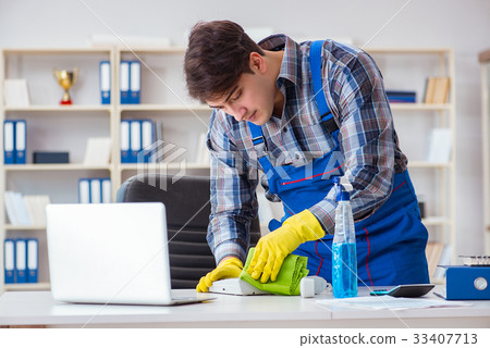 Male cleaner working in the office Male cleaner working in the office 33407713