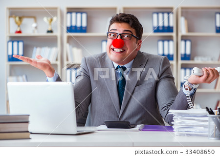 Clown businessman working in the office Clown businessman working in the office 33408650