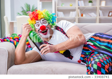 Drunk clown celebrating having a party at home Drunk clown celebrating having a party at home 33408741