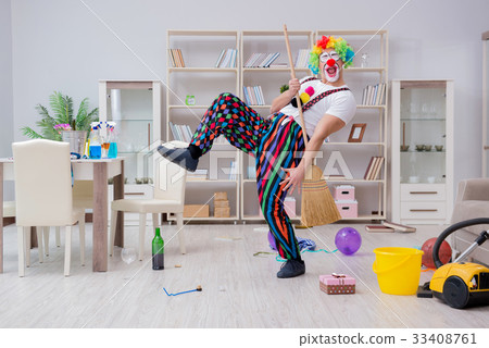 Funny clown doing cleaning at home Funny clown doing cleaning at home 33408761