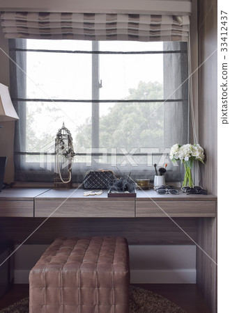 dressing room with makeup set on a wooden table 33412437