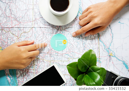 Pointing at map where traveling on world map Pointing at map where traveling on world map 33415532