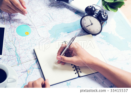 Writing note and consulting for traveling on map 33415537
