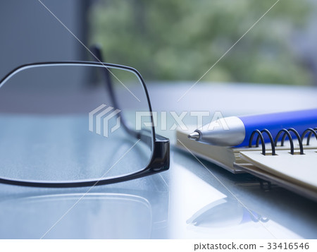 Business image · notebook · glasses 33416546