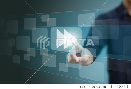 hand pushing a fast forward button on screen 33418863