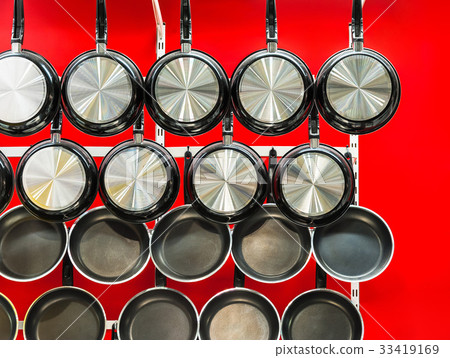 Metal black frying pans with a non-stick coating Metal black frying pans with a non-stick coating 33419169