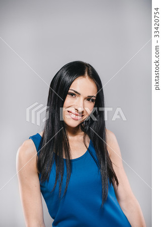 smiling girl in studio in blue dress smiling girl in studio in blue dress 33420754