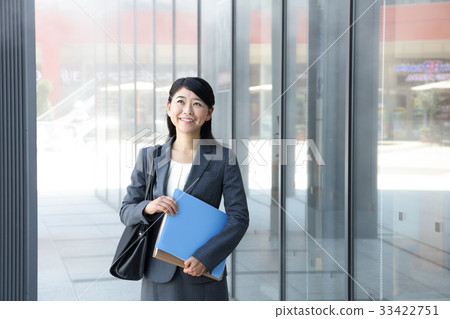 Office lady walking under mist shower 33422751