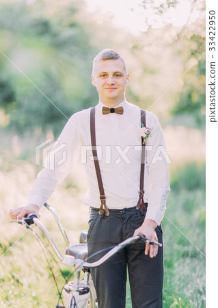 Smiling best man in the dark suit and black Smiling best man in the dark suit and black 33422950