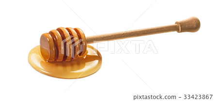 Wooden dipper in honey isolated on white Wooden dipper in honey isolated on white 33423867