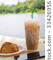 ice coffee with curry on wooden table. 33426956