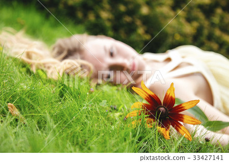 beautiful younge girl in a garden beautiful younge girl in a garden 33427141