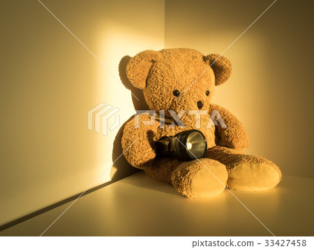 bear holding flashlight sitting alone emptiness bear holding flashlight sitting alone emptiness 33427458