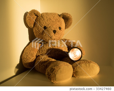 bear holding flashlight sitting alone emptiness bear holding flashlight sitting alone emptiness 33427460