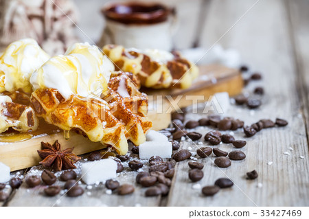 Waffers with ice cream and honey background Waffers with ice cream and honey background 33427469