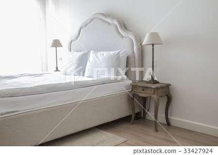 comfortable double bed and lamp in classic bedroom comfortable double bed and lamp in classic bedroom 33427924