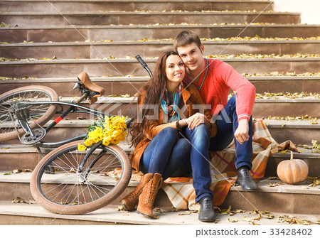 Portrait of couple enjoying golden autumn season Portrait of couple enjoying golden autumn season 33428402
