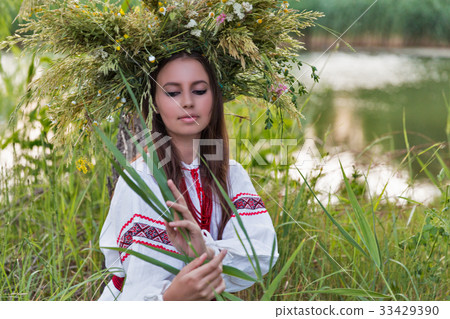 Beautiful girl in embroidery shirt and wreath Beautiful girl in embroidery shirt and wreath 33429390