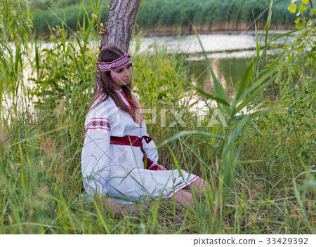 Beautiful young girl in Ukrainian embroidery dress 33429392
