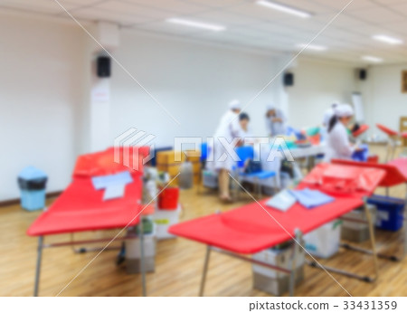Abstract blur of volunteer people donating blood Abstract blur of volunteer people donating blood 33431359