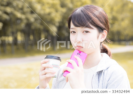A young woman with a smartphone A young woman with a smartphone 33432494