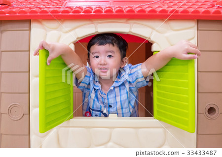 Happy Asian child Boy playing window toy house Happy Asian child Boy playing window toy house 33433487