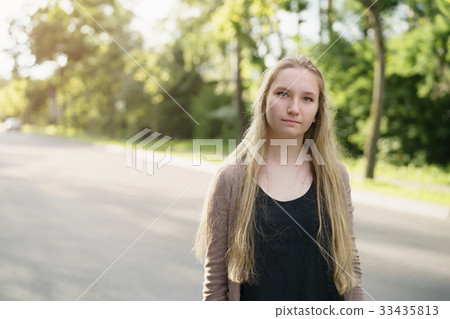 teen girl portrait in town in sunny summer day 33435813