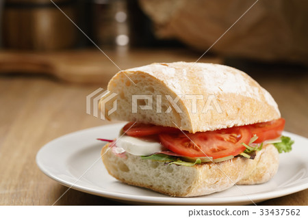ciabatta sandwich with speck, mozzarella and 33437562