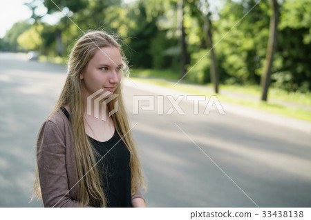 teen girl portrait in town in sunny summer day 33438138