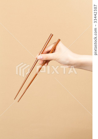 Hand, chopsticks Hand, chopsticks 33442387