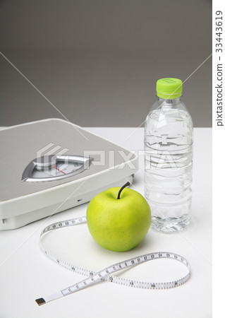 Diet, scale, apple, tape measure, bottled water Diet, scale, apple, tape measure, bottled water 33443619