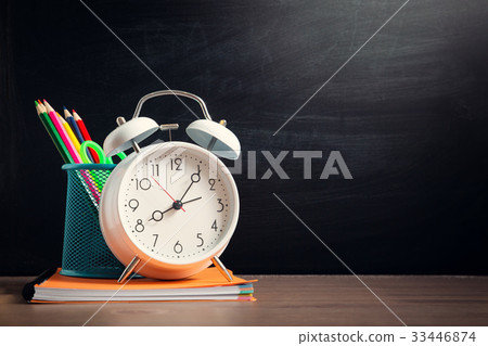 school accessories on the table with blackboard school accessories on the table with blackboard 33446874