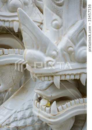 Fragment of white ceramic naga snake statue Fragment of white ceramic naga snake statue 33457536