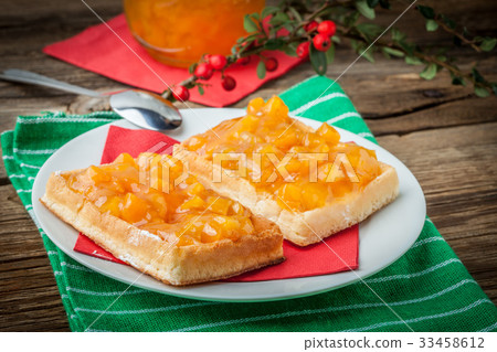 Waffles with peach jam. Waffles with peach jam. 33458612