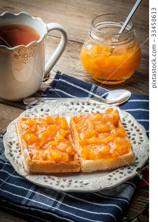 Waffles with peach jam. Waffles with peach jam. 33458613