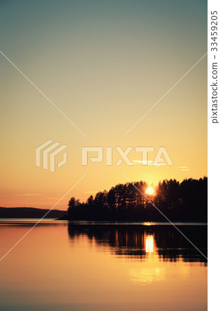 Summertime. Peaceful sunset at Kenozero lake. 33459205