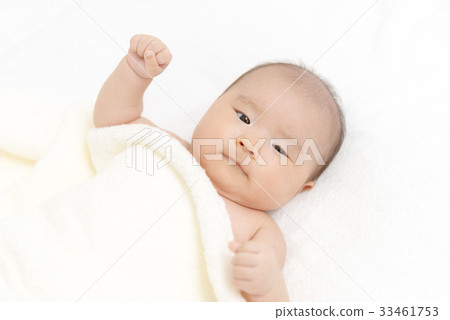 Baby wrapped in towel 33461753
