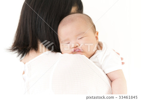 Baby sleeping in a mother's embrace 33461845