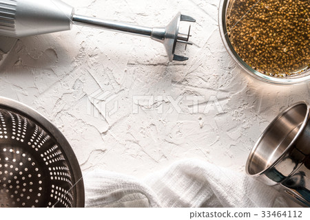 Bowl with cannabis seeds, a blender and a sieve on Bowl with cannabis seeds, a blender and a sieve on 33464112
