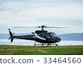 Black tourist helicopter rises in the air 33464560