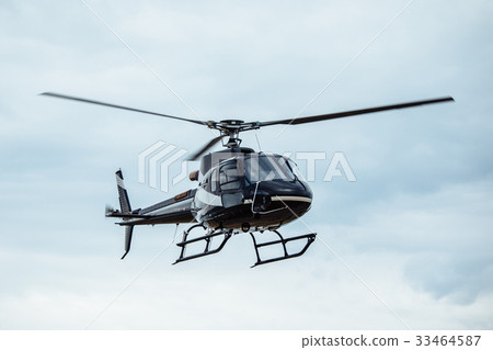 Black tourist helicopter flying 33464587